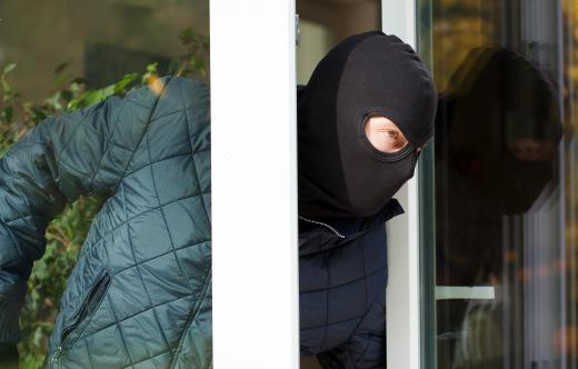A cat burglar will slip in unnoticed and steal items before the victim has notice what has happened.