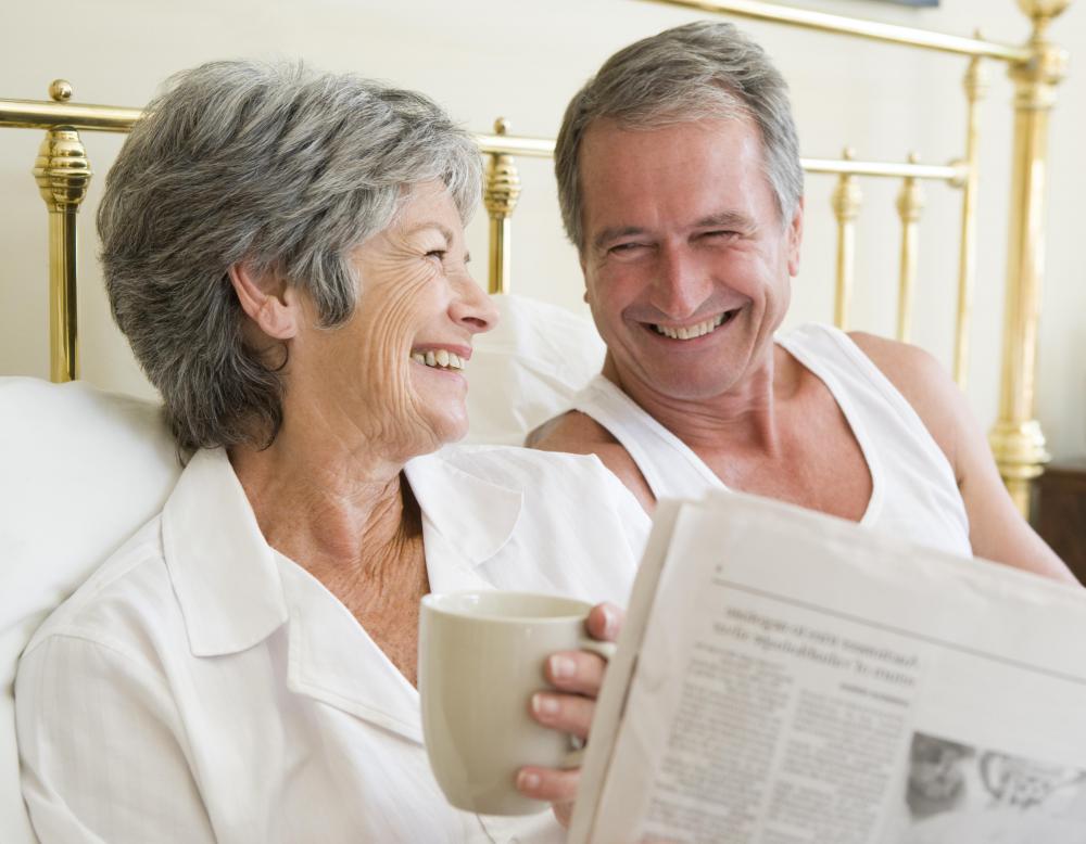 older-man-and-woman-in-bed-with-coffee-m